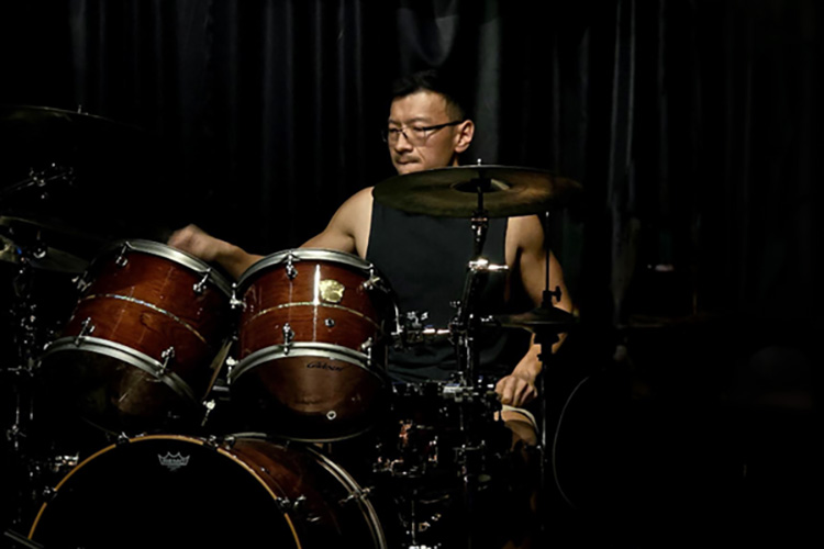 Photo: Marvin Tan on the drums.