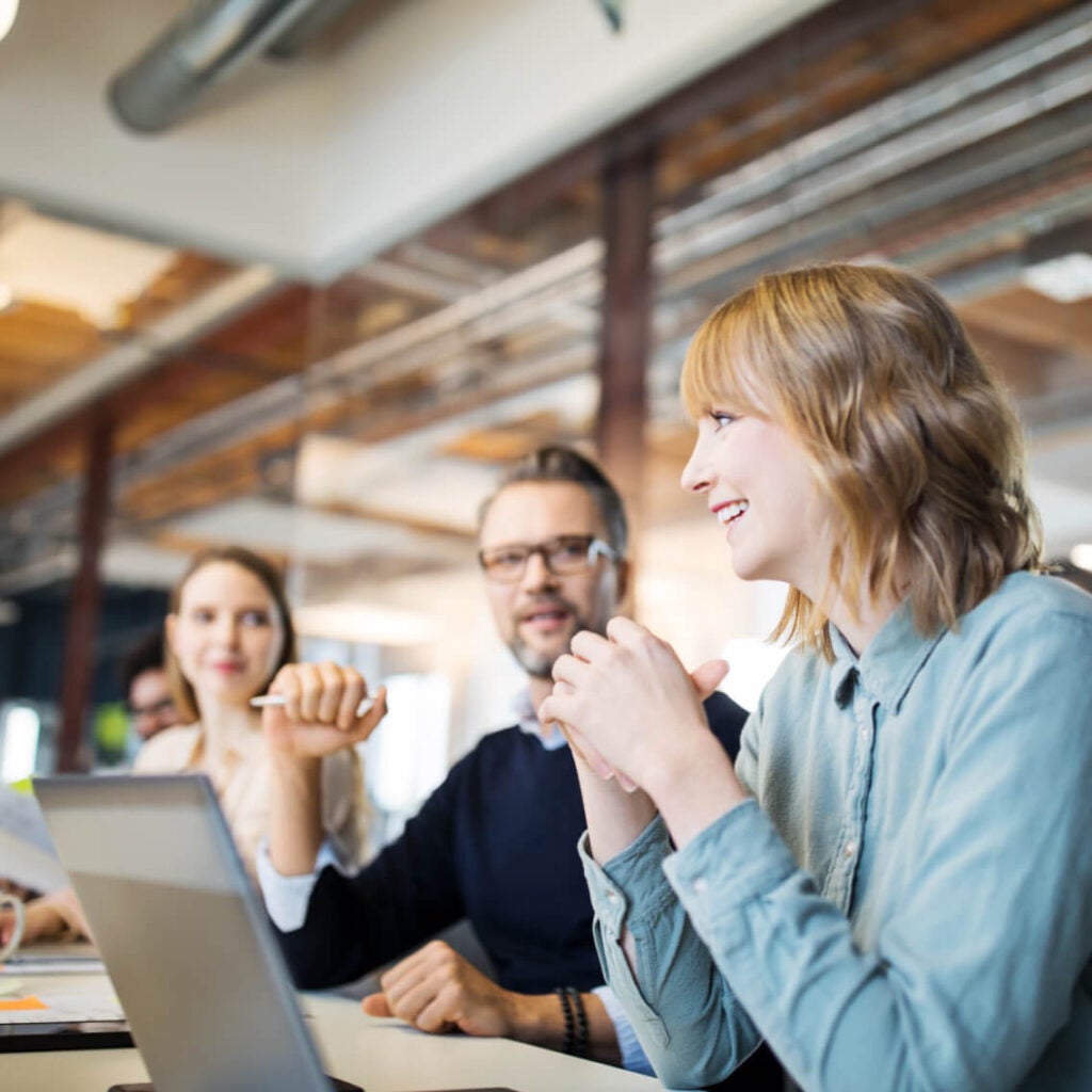 People working in a conference room.