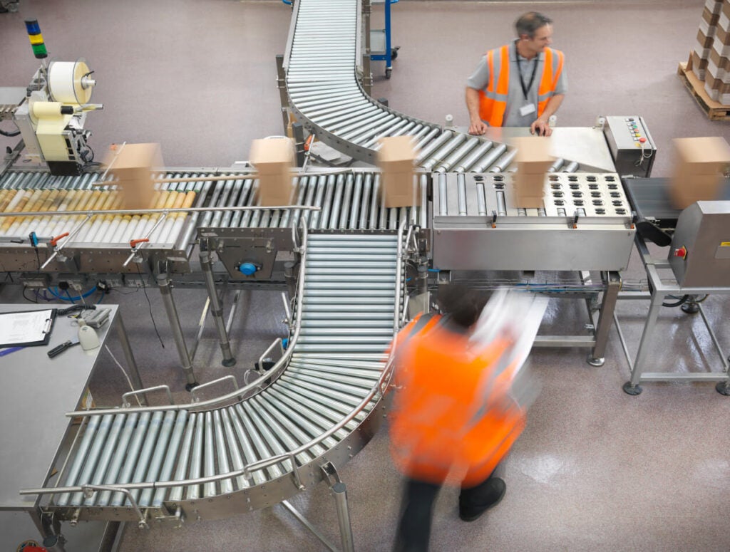 Workers on a manufacturing floor.