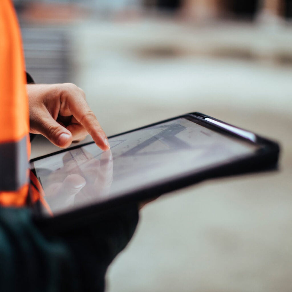 A close-up of someone using a tablet.