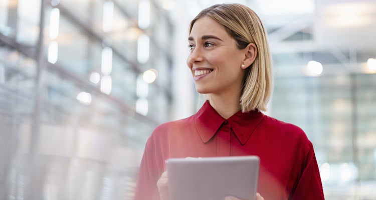 Image of a woman holding a laptop.