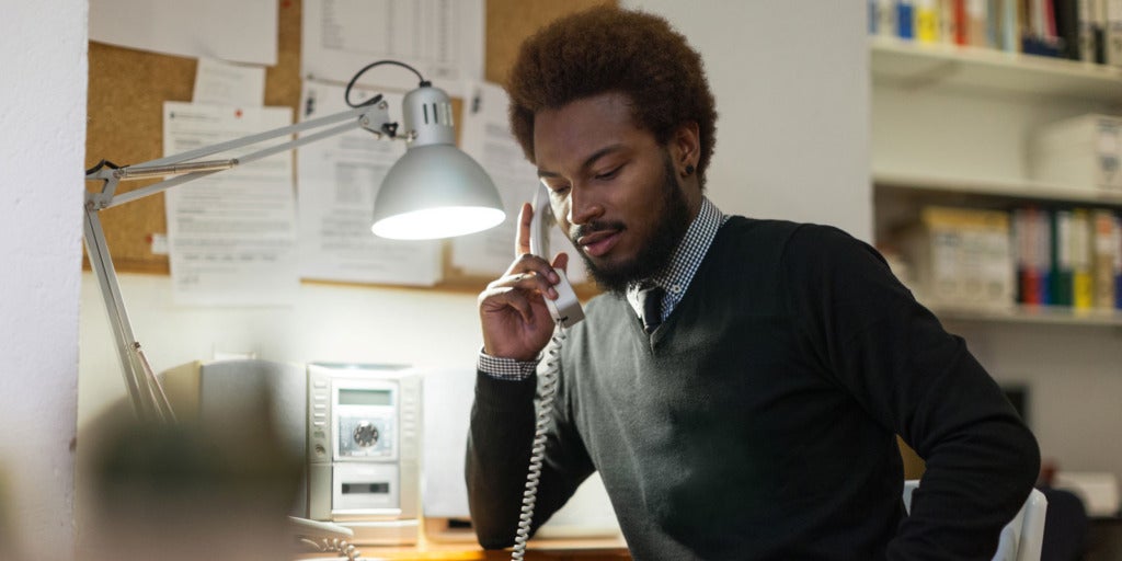 Worker answering phone