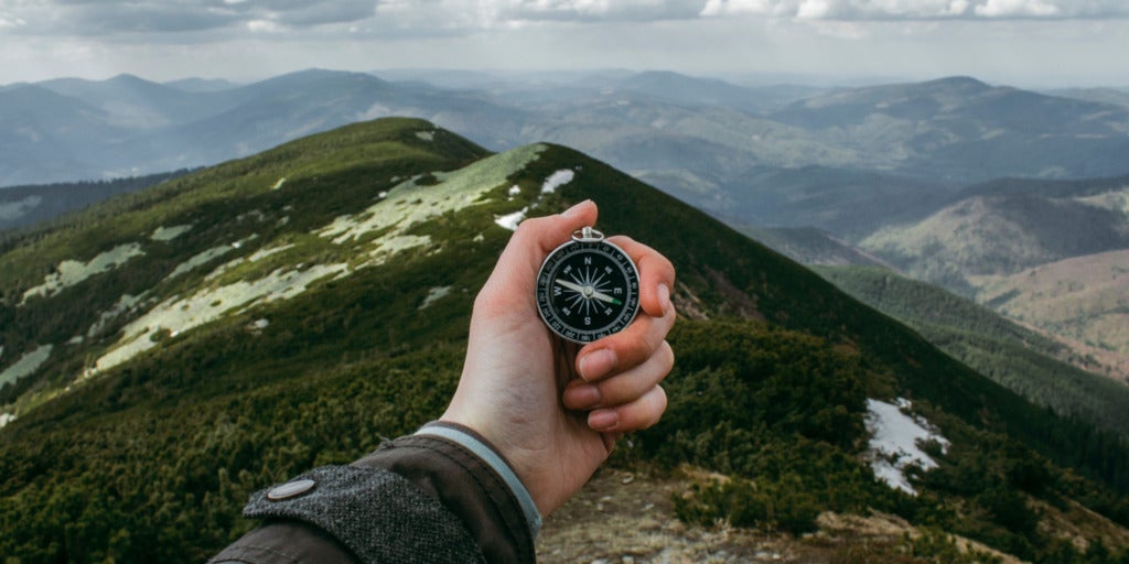 Photo of hand with compass